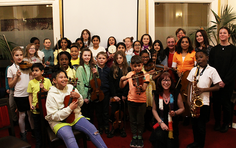 Diverse and inclusive orchestra, young musicians holding their instruments