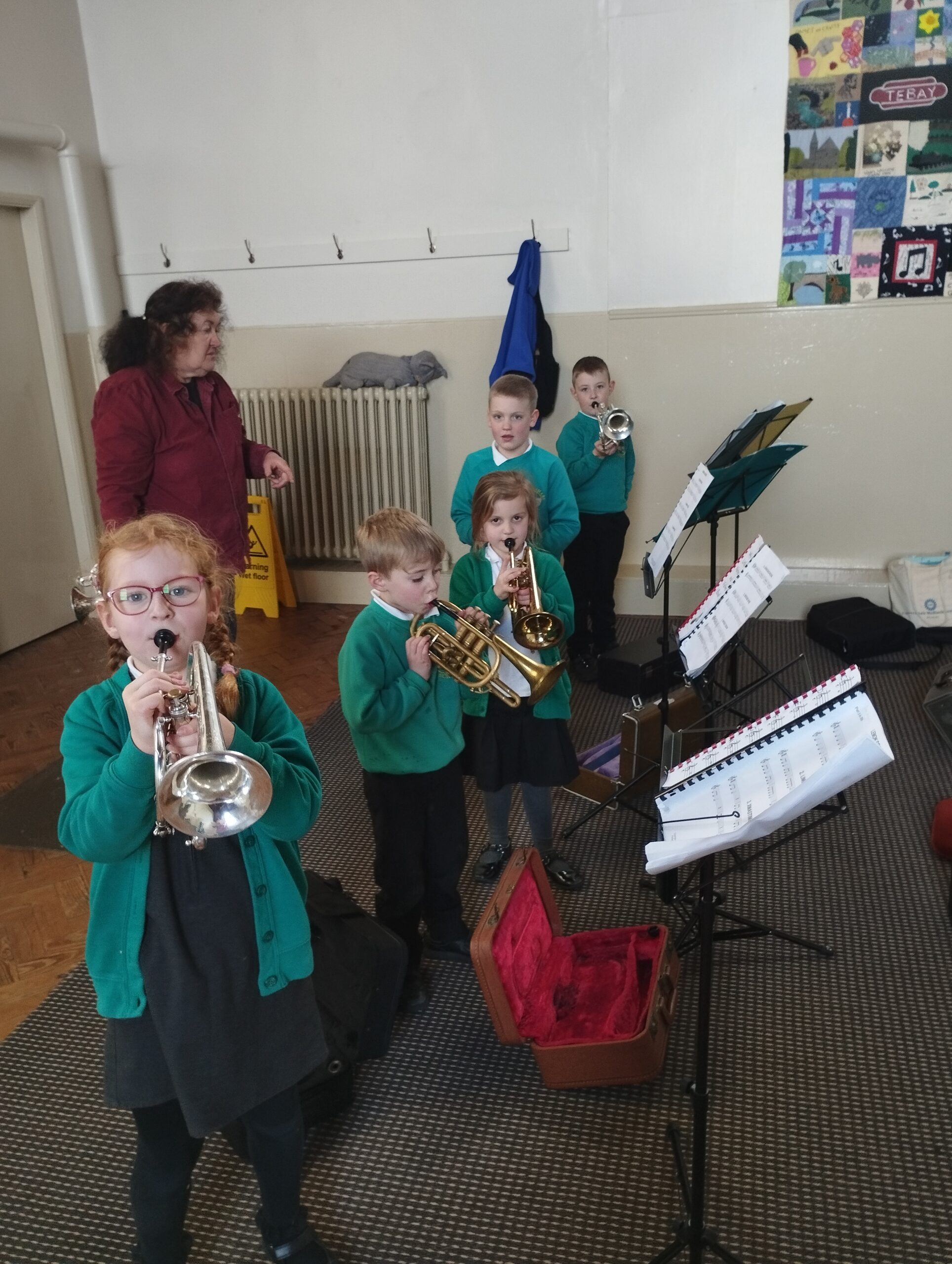 5 young white children with brass cornets and music on stands